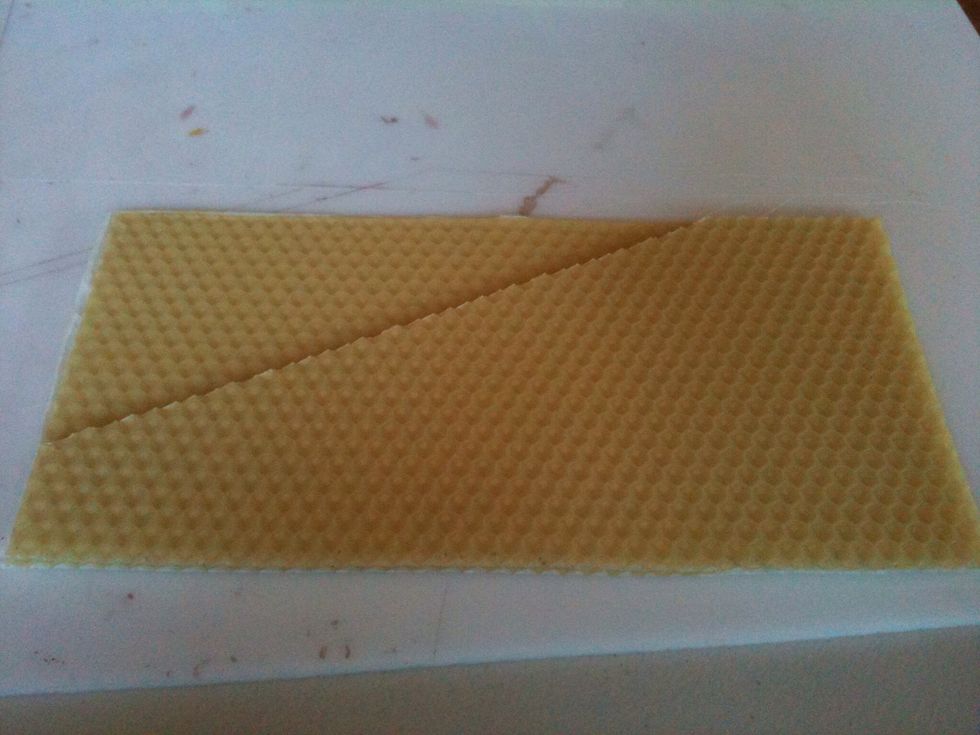 Place the cut piece on top of the other quartered sheet, making sure the side and bottom edges are aligned.
