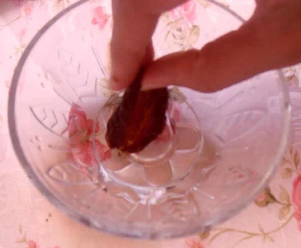 Place the date in water blossom for a second and then get it out