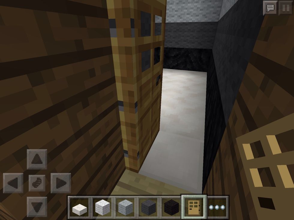 Place the door between the two separate walls, to seem more realistic.