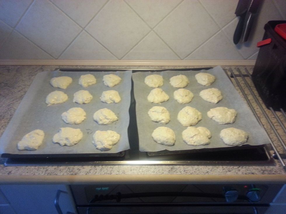 Place the dough on the baking trey with two spoons. Dip the spoons in cold water between each bun, otherwise the dough will stick to the spoons