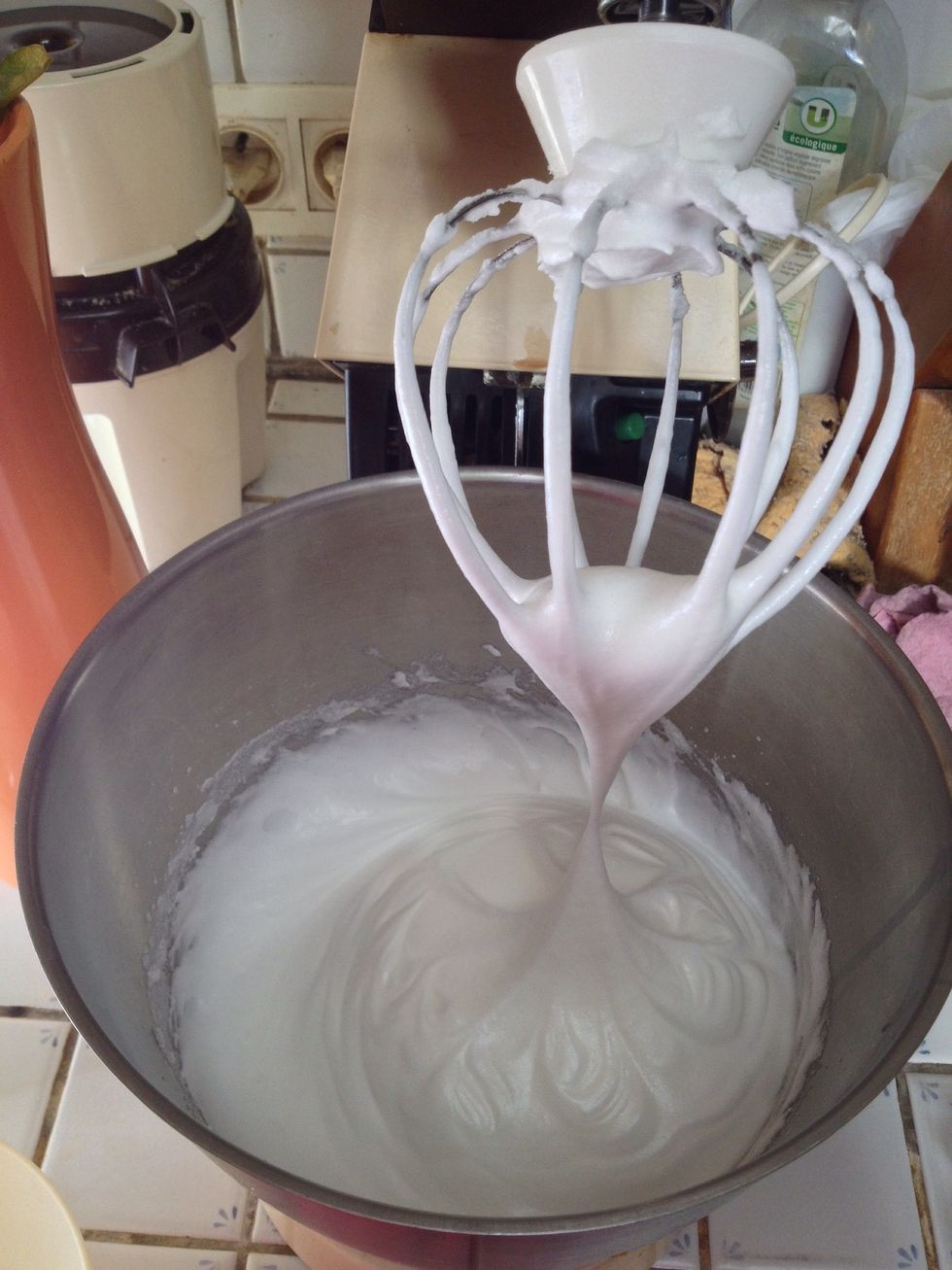 Place the egg whites in a stand mixer with lemon and a pinch of sugar. Operate at slow speed. Once bubbles form on the sides, put on fast speed: whites become tough. Add the rest of sugar.