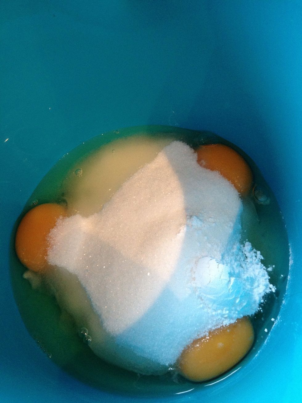 Place the eggs, granulated sugar and vanilla sugar in a bowl.