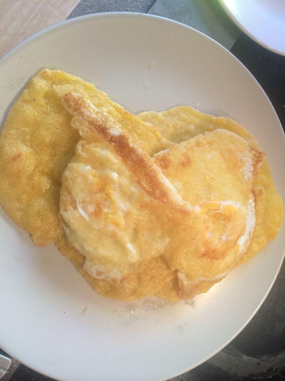 Place the eggs onto the tortillas.