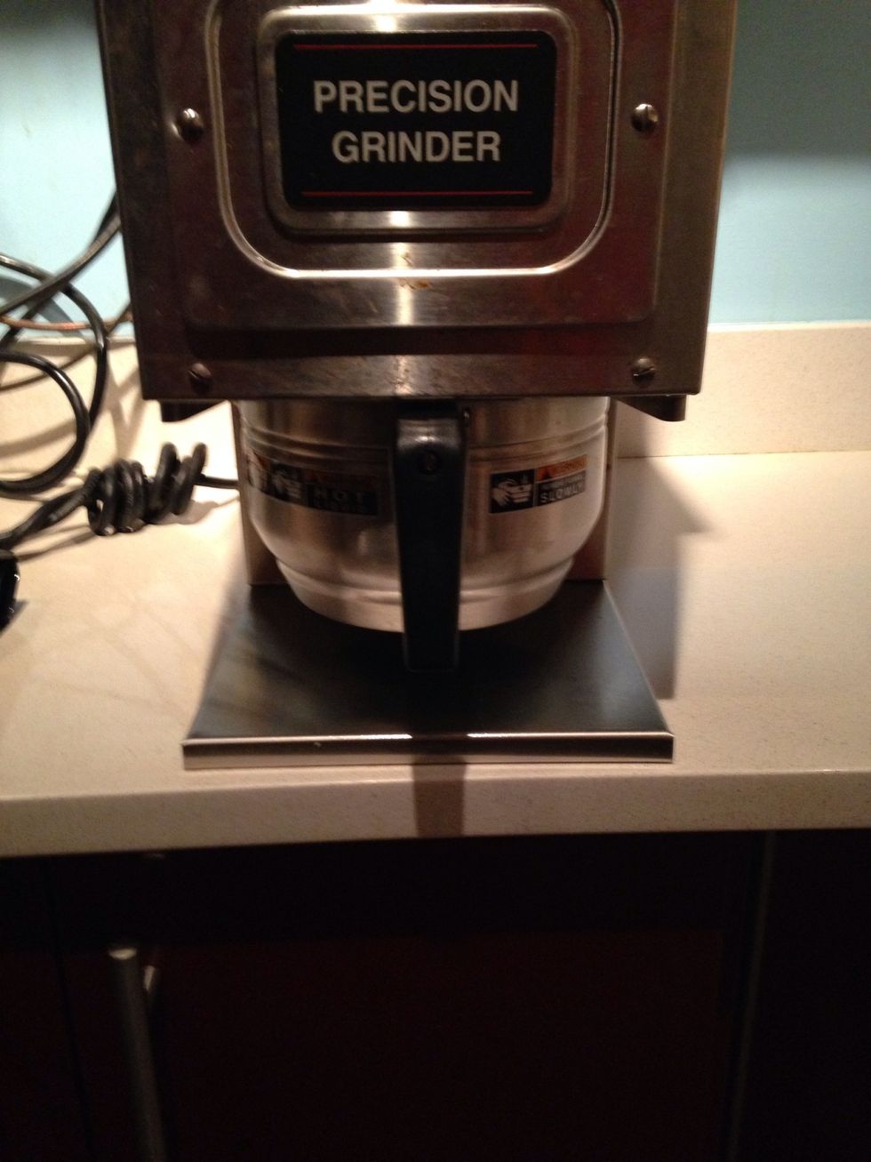 Place the filter and holder into the grinder.