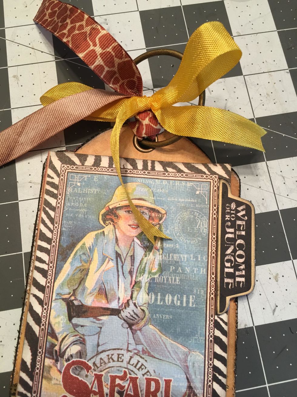 Place the finished tag onto the metal ring which will be the binding of your album.