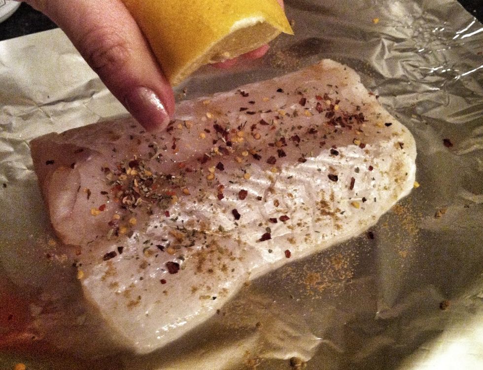 Place the fish on a large piece of tin foil. Sprinkle some cumin, chilli flakes, oregano, sea salt and pepper on top, and add a squeeze of lemon. Other ideas: lemongrass, spring onion, parsley.