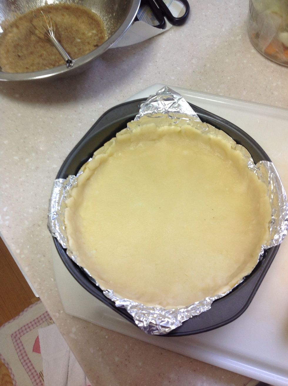Place the flat dough into the pan.