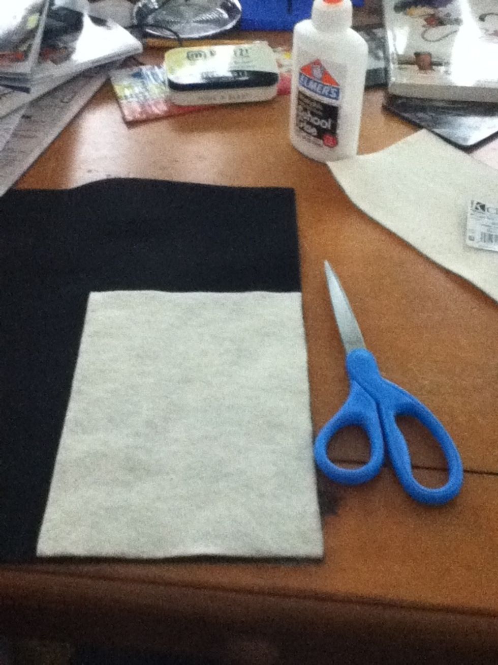 Place the flesh colored rectangle on top of the black and cut around it.