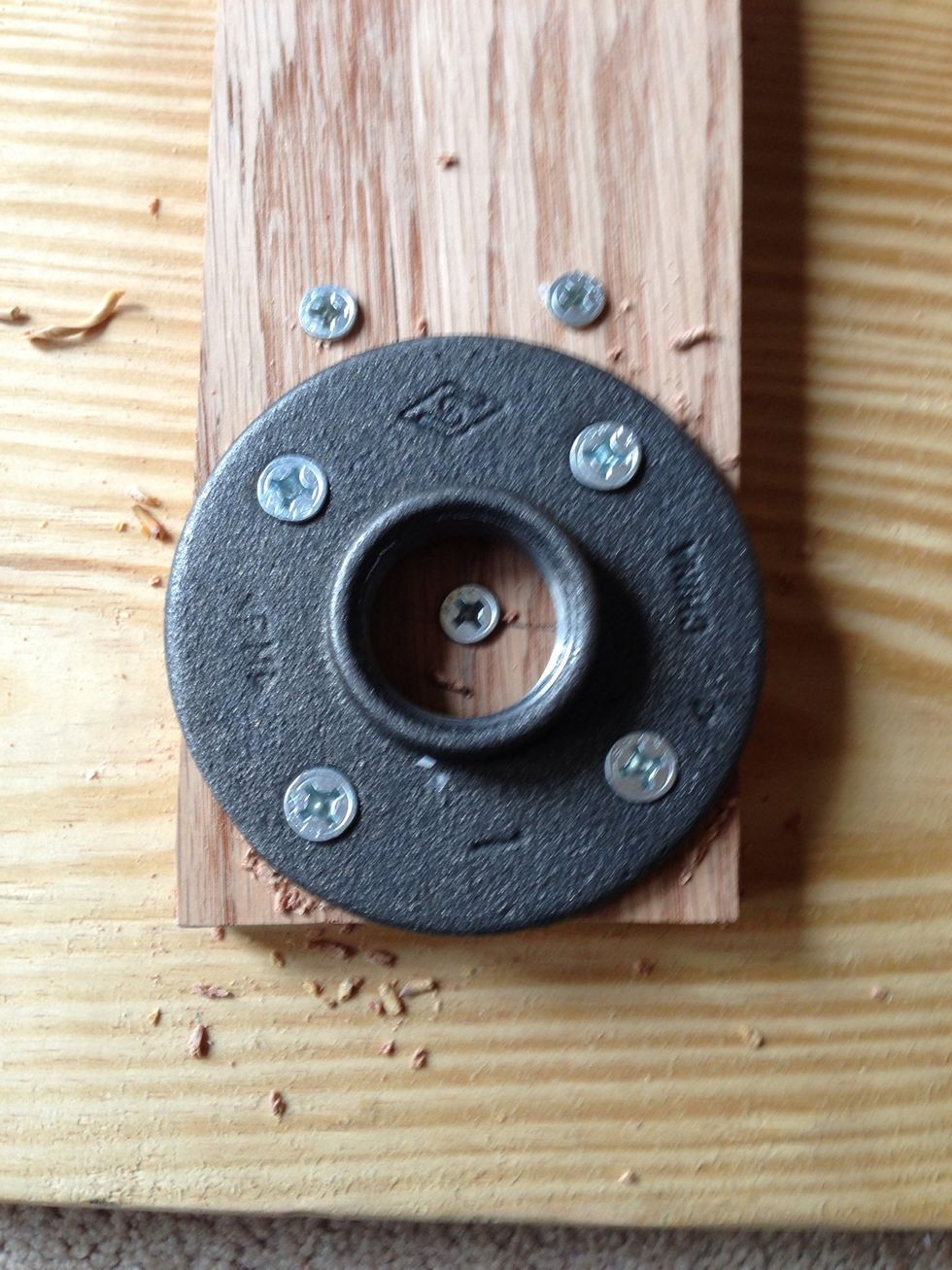 Place the floor flanges on the end support boards and make sure the pipes will line up to each other. This is when you will drill 16 holes for the 4 floor flanges.