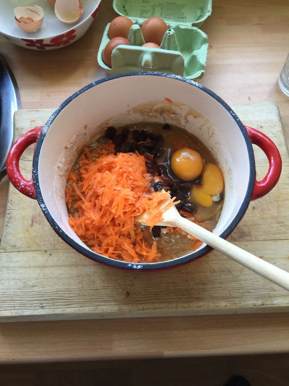Place the flour , bi carb, cinnamon, salt, carrots and sultanas into the wet mixture