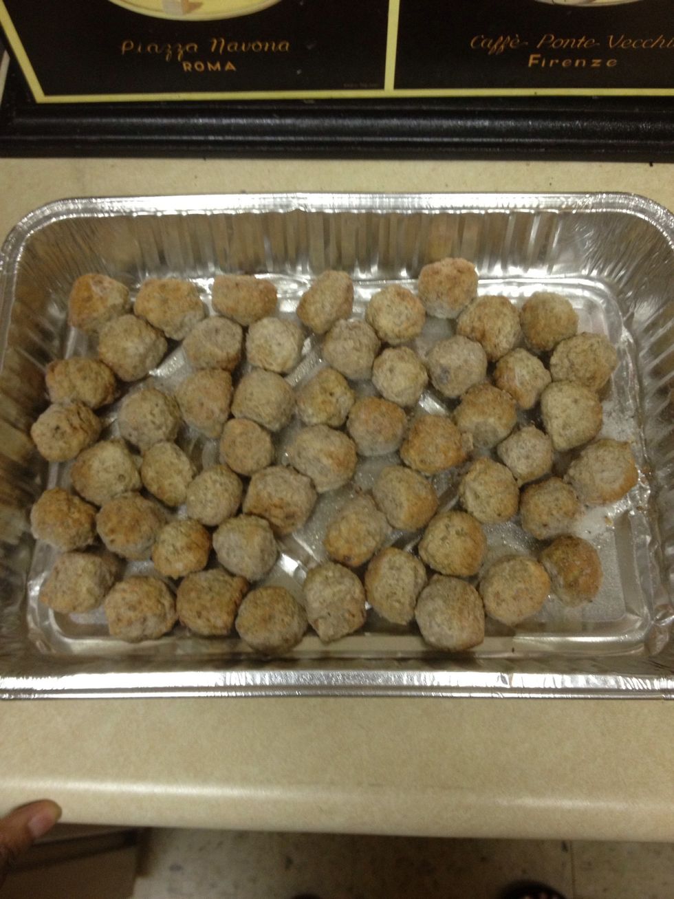 Place the frozen meatballs in a single layer in a baking pan. (I always spray the bottom of my pans with cooking spray first to be on the safe side.) Place the pan in the oven and cook for 20-25 mins.