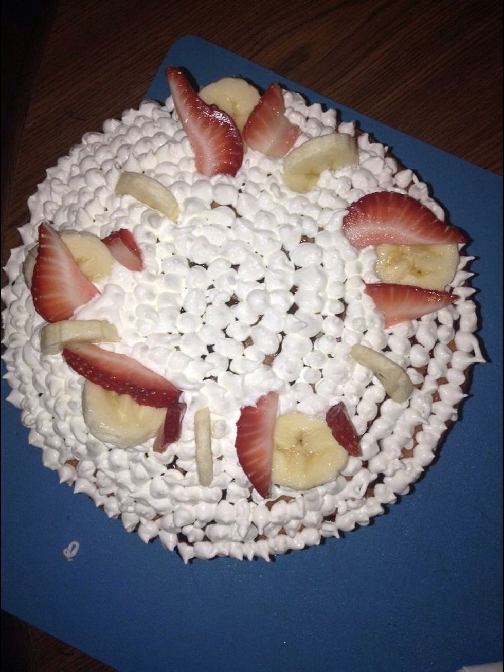 Place the fruit around the outside of the cake leaving a circular spot in the middle of the cake.