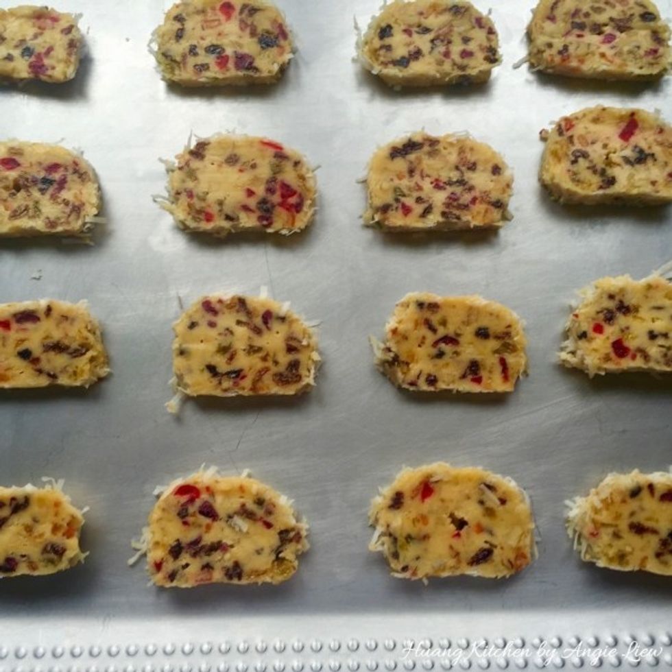 Place the fruitcake slices on ungreased cookie sheets about 1 inch apart.