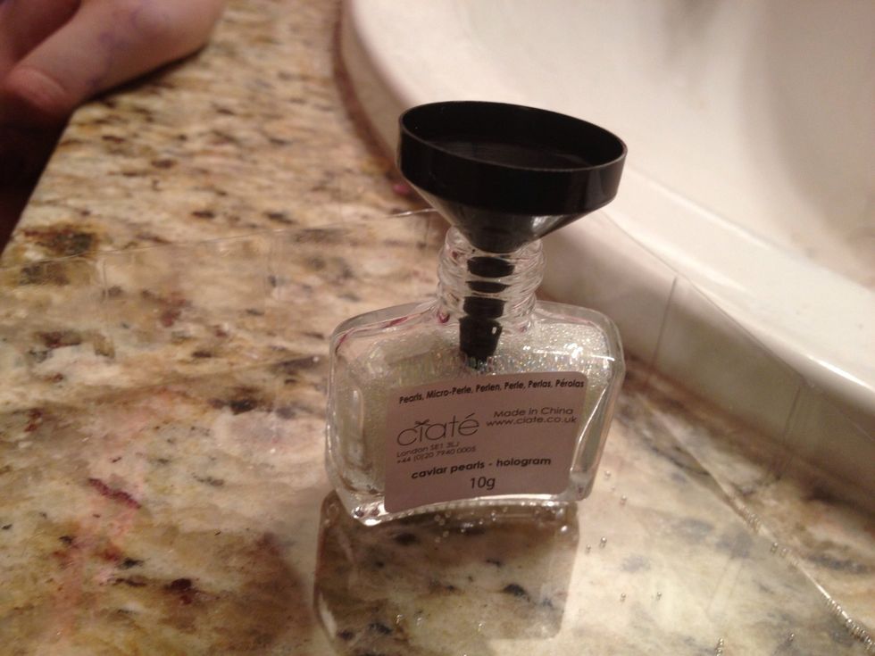 Place the funnel in the bottle.