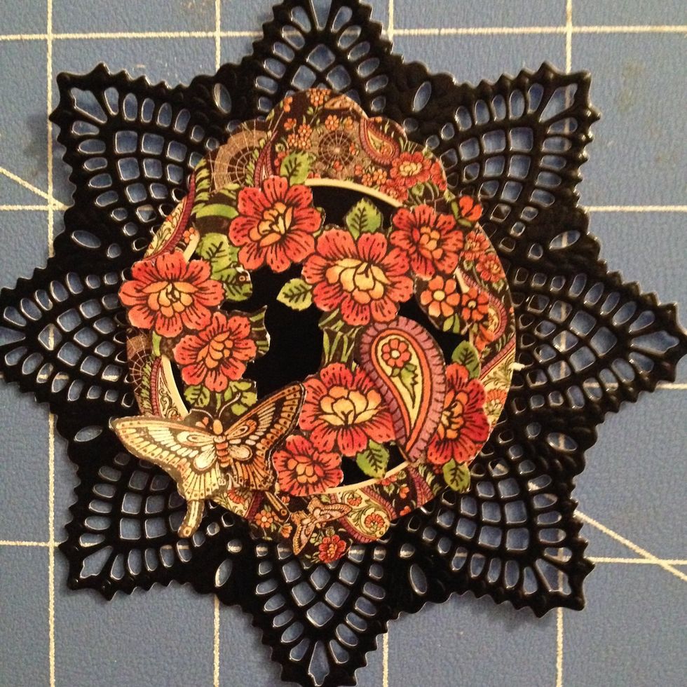 Place the fussy cuttings inside the circle to your liking. Adhere with wet glue.