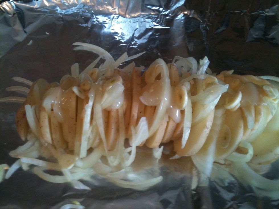 Place the garlic in between onions and potatoes.