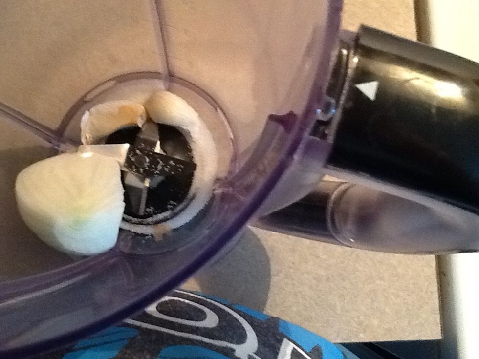 Place the garlic,salt and a pice of onion in the blender with