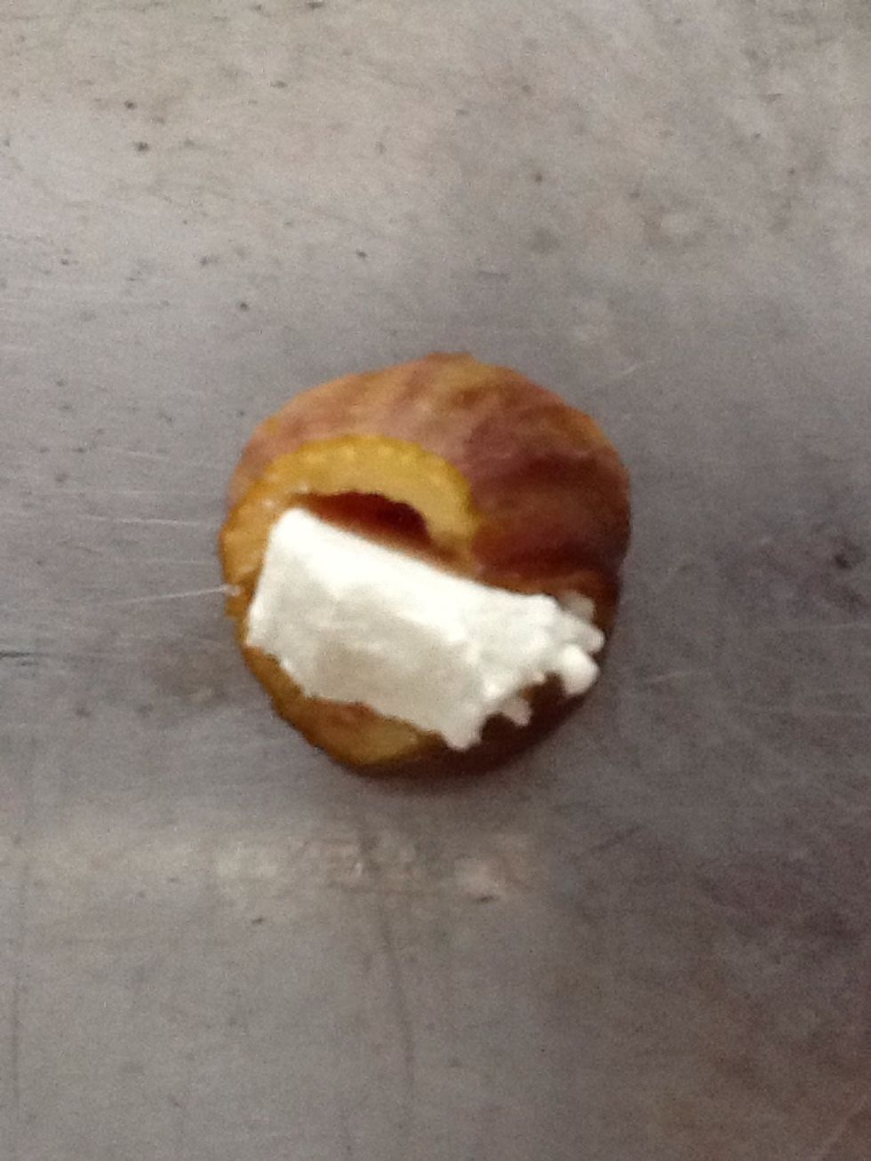 Place the goat cheese slices in the cleaned, hollowed fig.