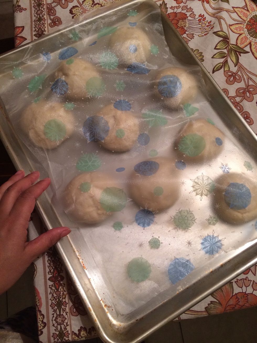 Place the greased cling wrap over the balls. Make sure they are well covered. Let them rest for another 30 minutes until doubled in size