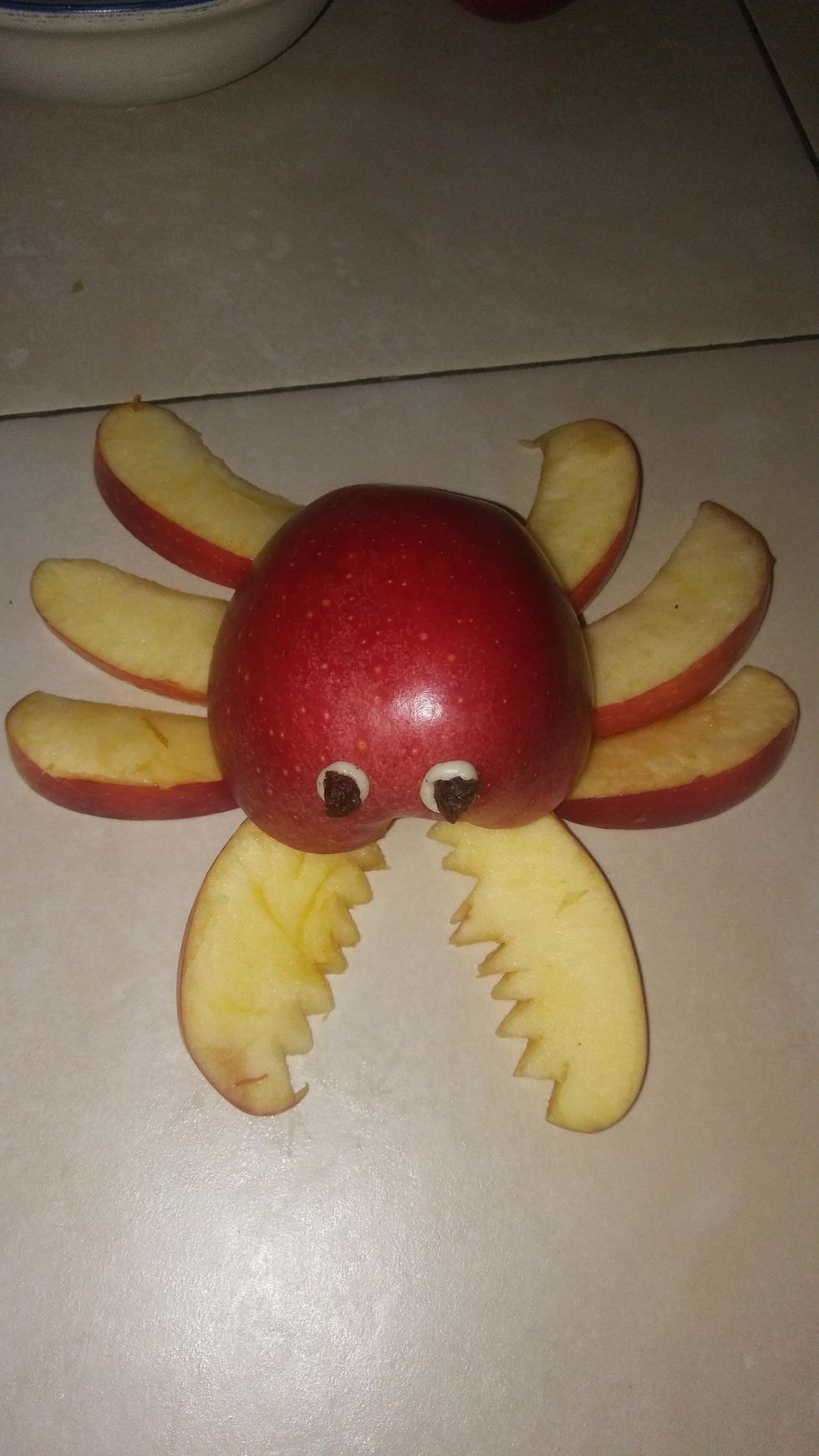 Place the half of your apple back on the pieces (legs) and you're all done!!