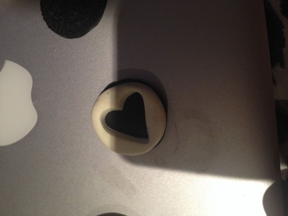 Place the heart cutout on one side of the cookie