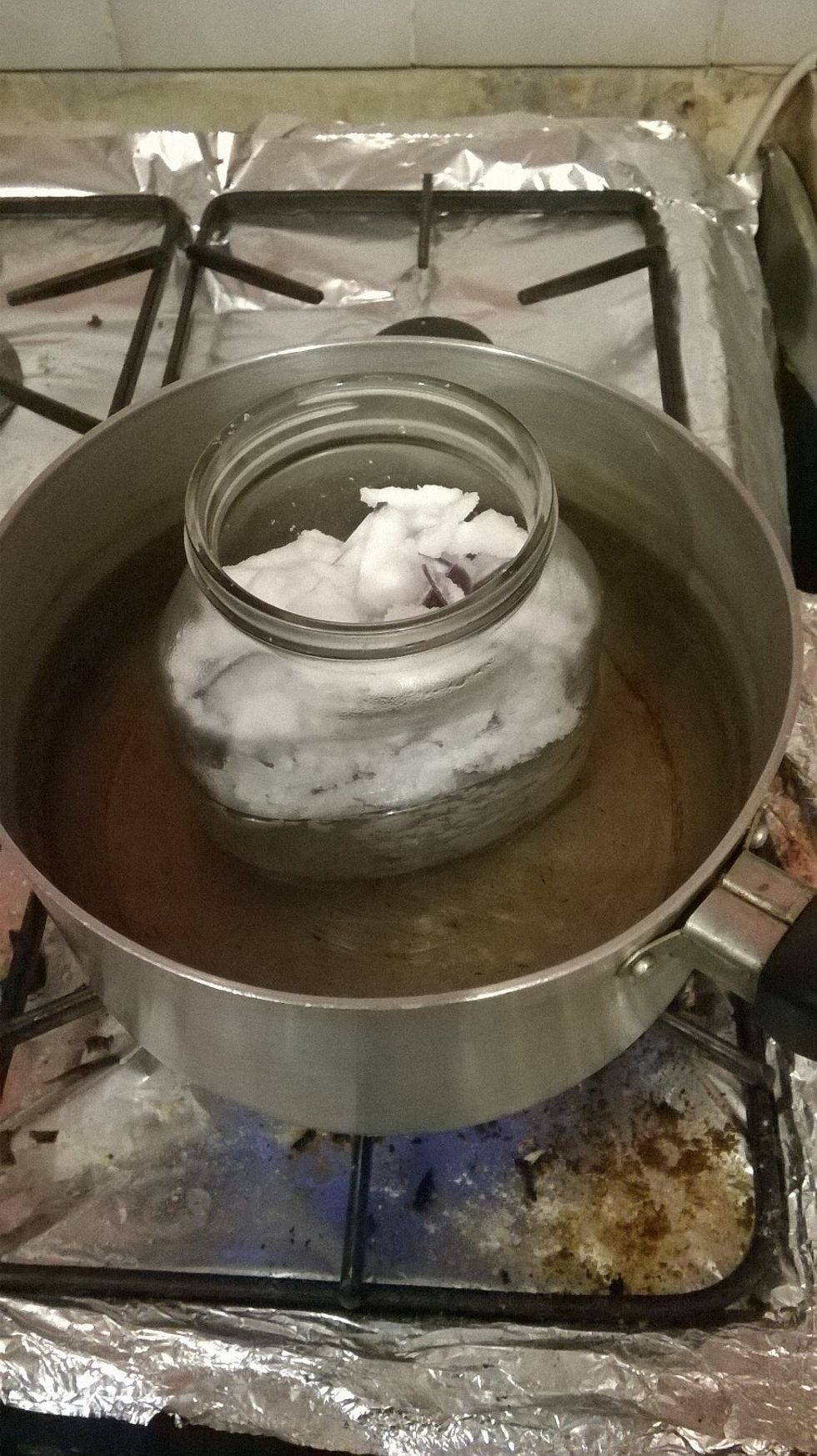 Place the jar into the pot. This is to ensure that nothing burns, and that the wax gets an even distribution of heat - making the process a bit quicker.