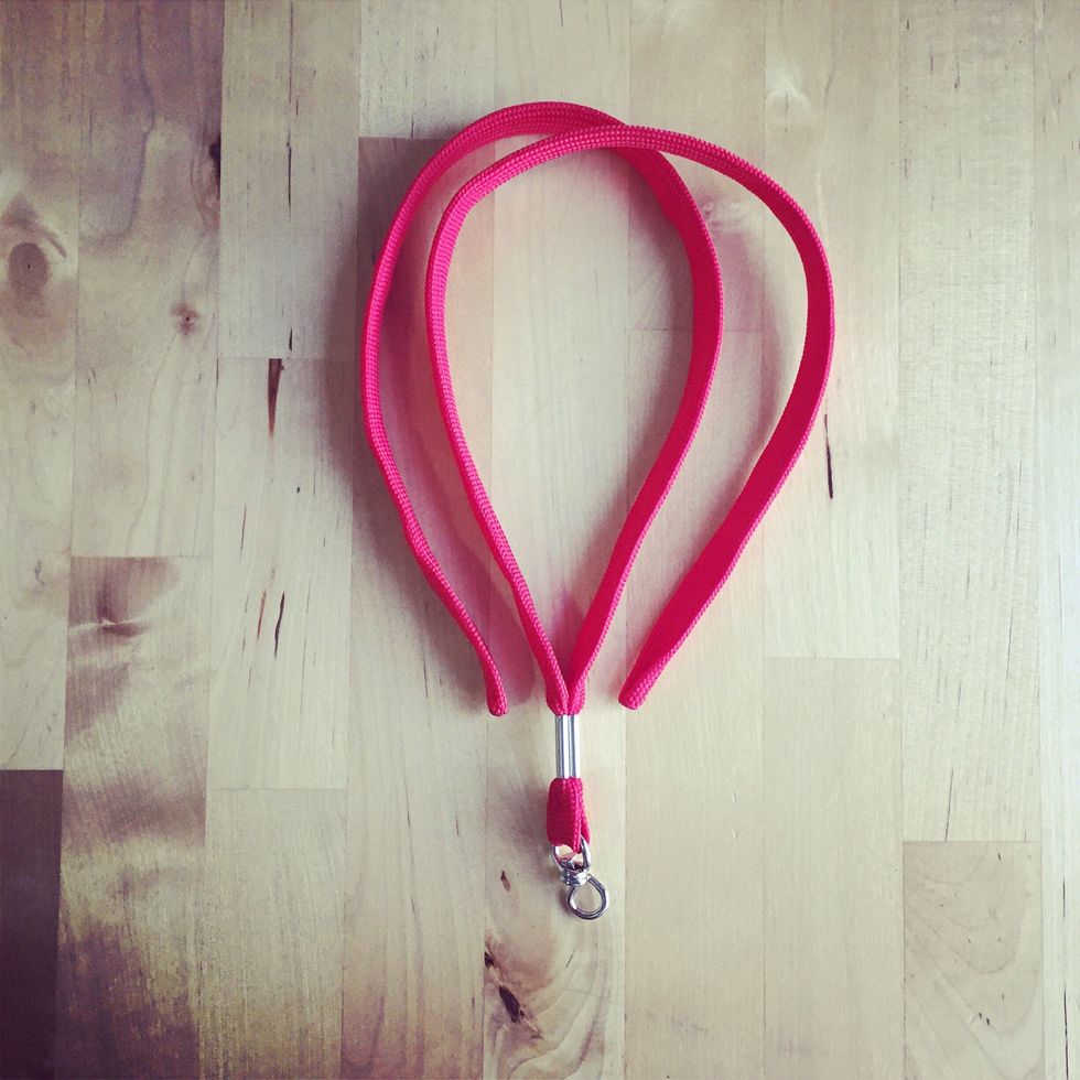 Place the lanyard into position.