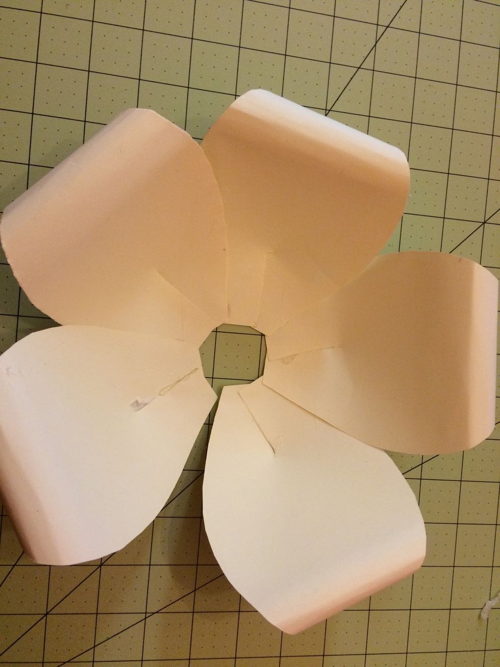 Place the last petal on top of the small opening to connect