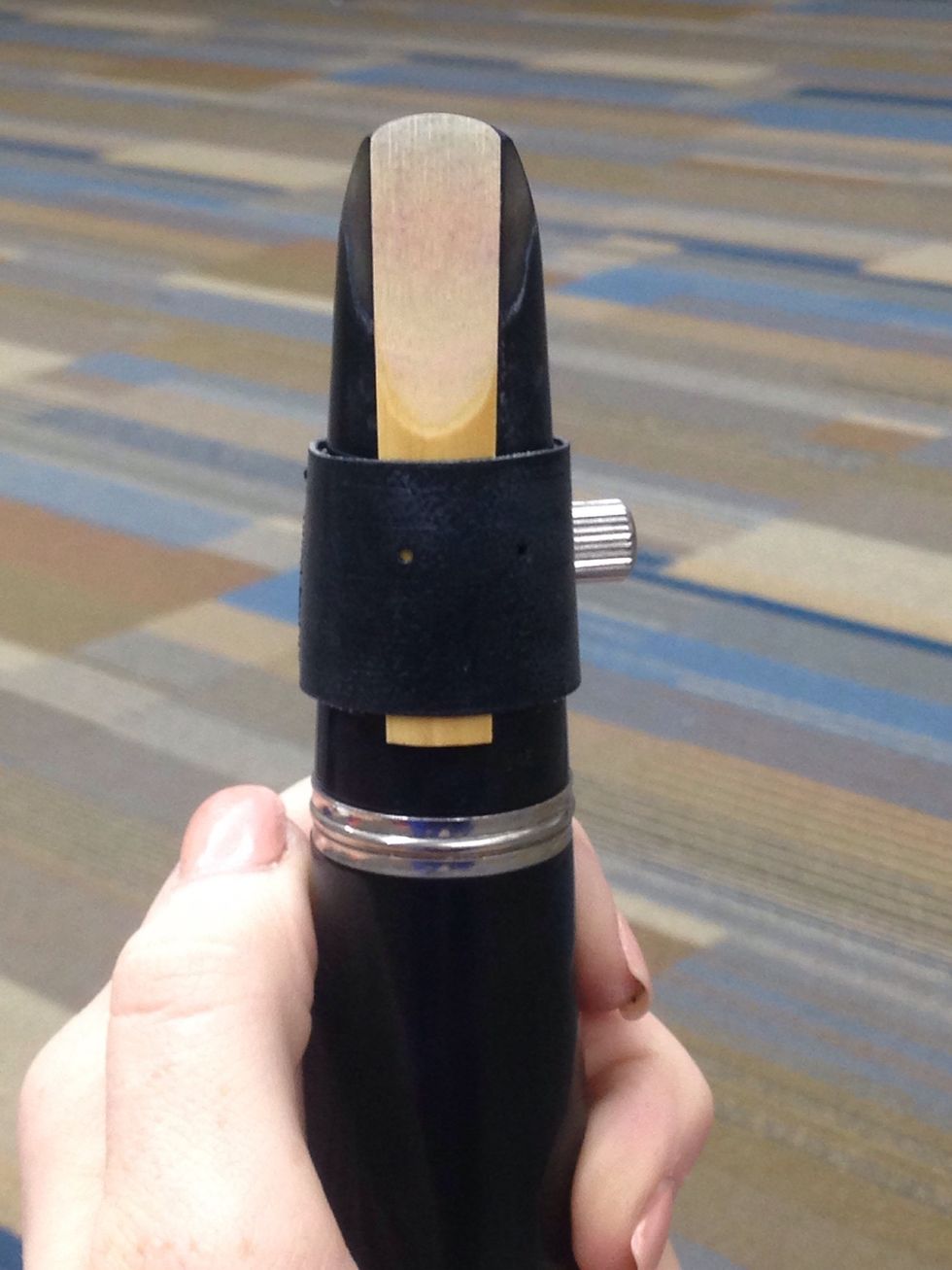 Place the ligature around the mouthpiece and the reed.