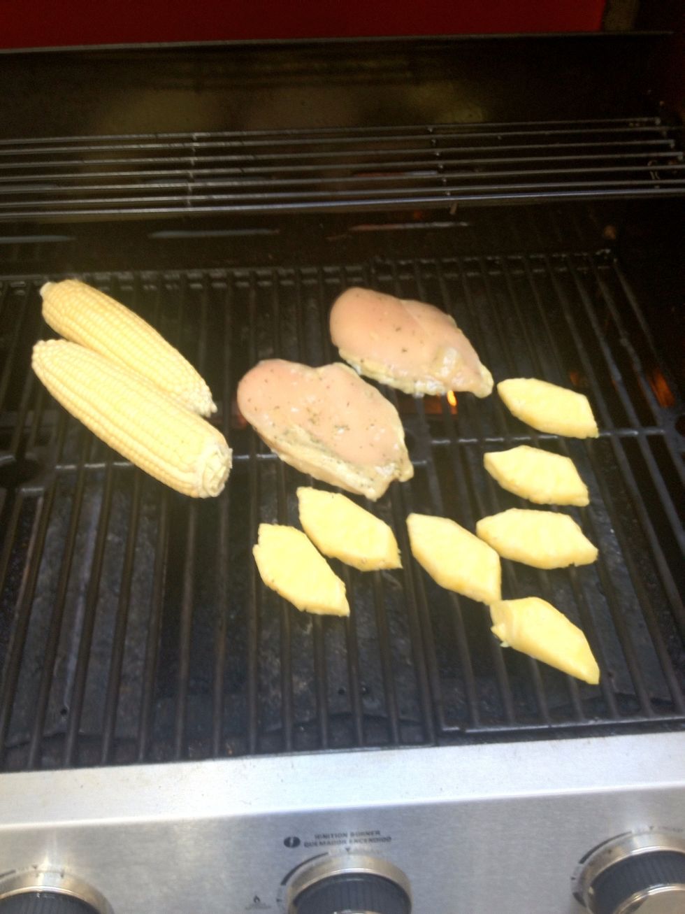 Place the longer cooking items on your grills hot spots