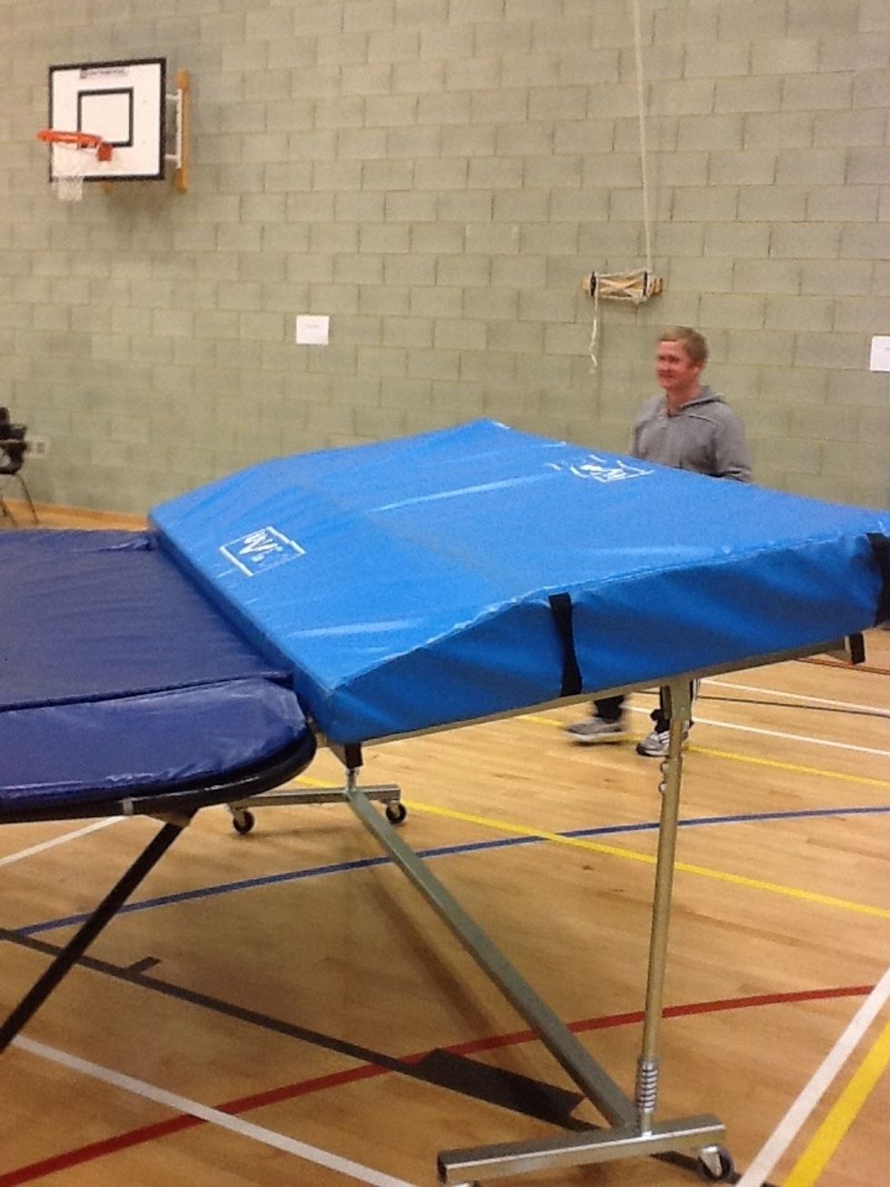 Place the mat on top of the end deck, with the sloped end facing the trampoline. Surround the trampolines with gym mats and ensure when more than 1 trampoline is out, cover the joins with crash mats.