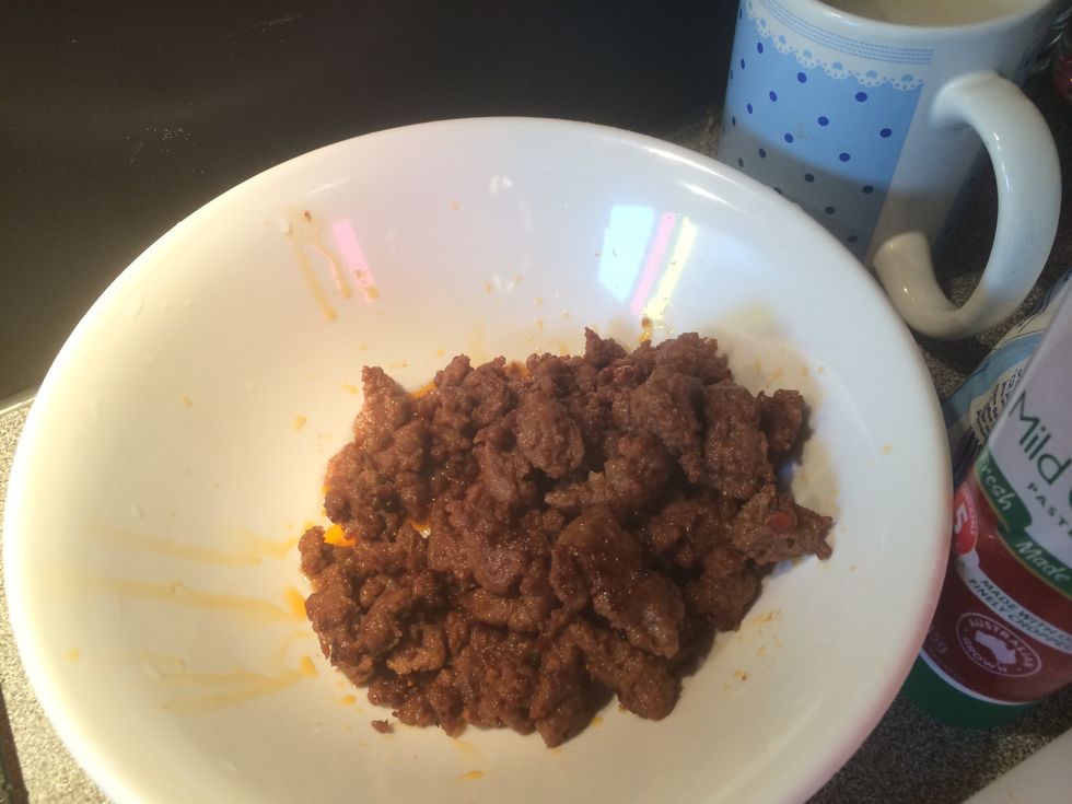 place the meat into a bowl.