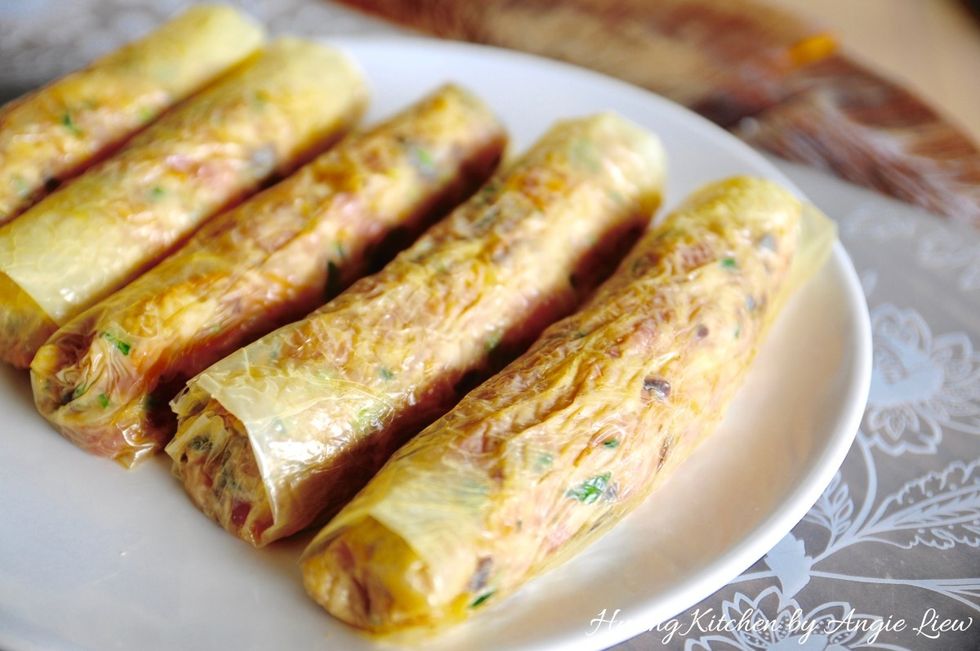 Place the meat rolls on a steaming plate seam side down. Repeat process to finish wrapping all the meat filling with the beancurd skin. You will get about 12 meat rolls.