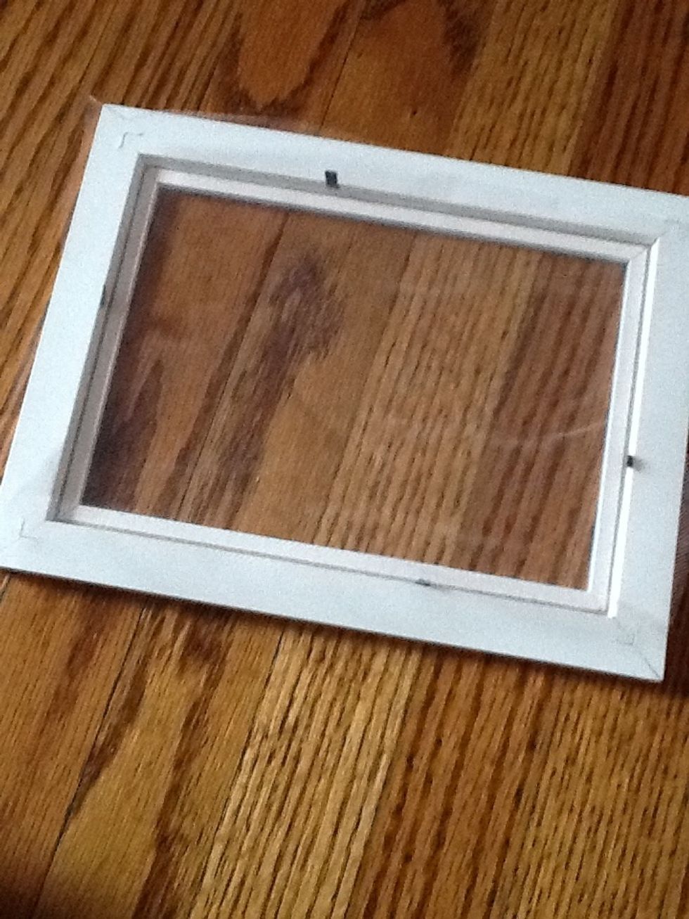 Place the mesh fabric over the back of the frame.