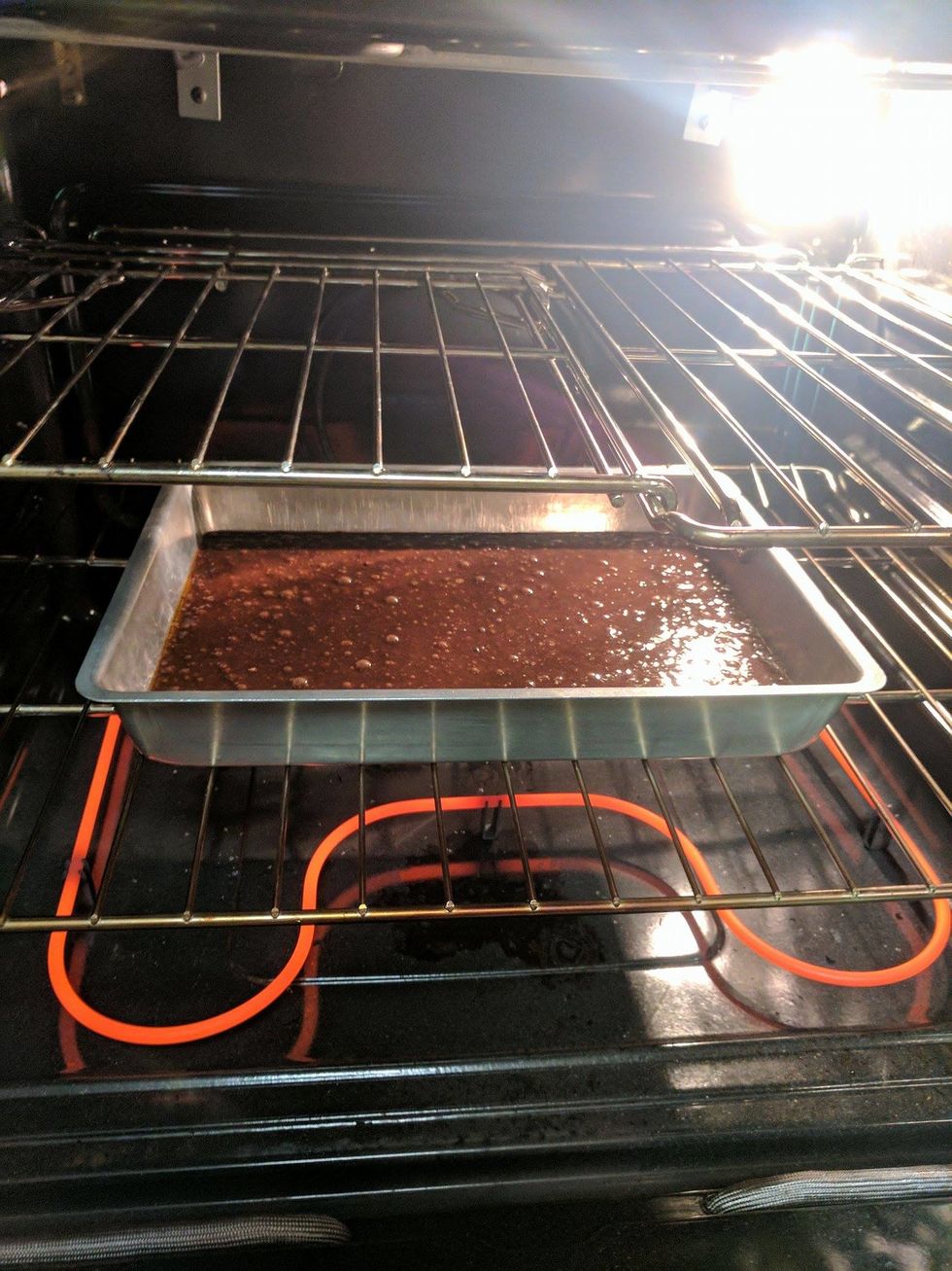 Place the metal pan onto the center of a rack in the preheated oven.