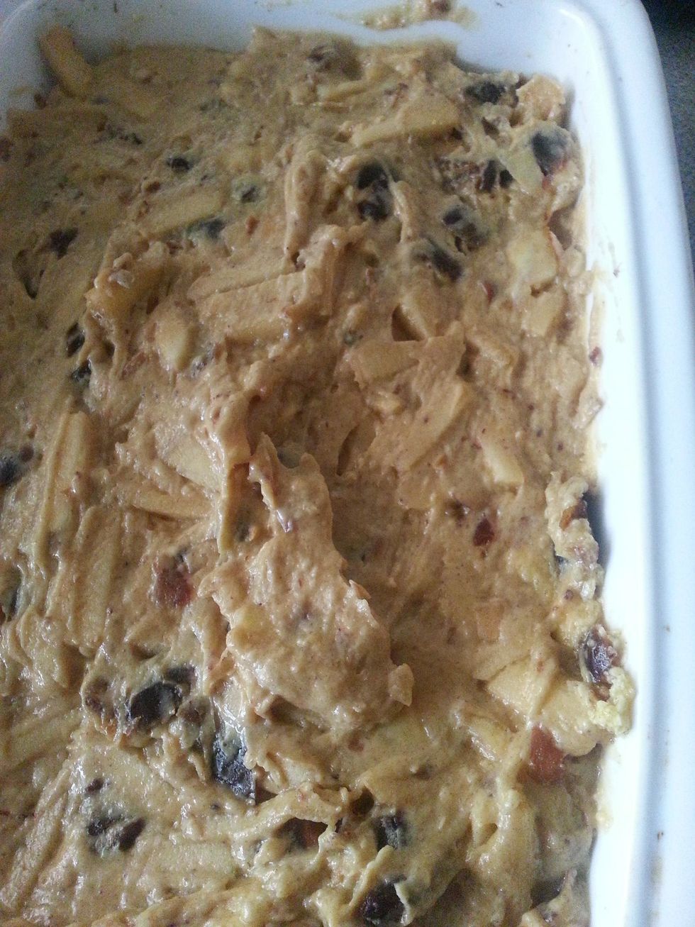 Place the mixture into the baking pan. Using a spatula- smooth the top of the mixture. Place it in the oven for 50 minutes or until cooked through.