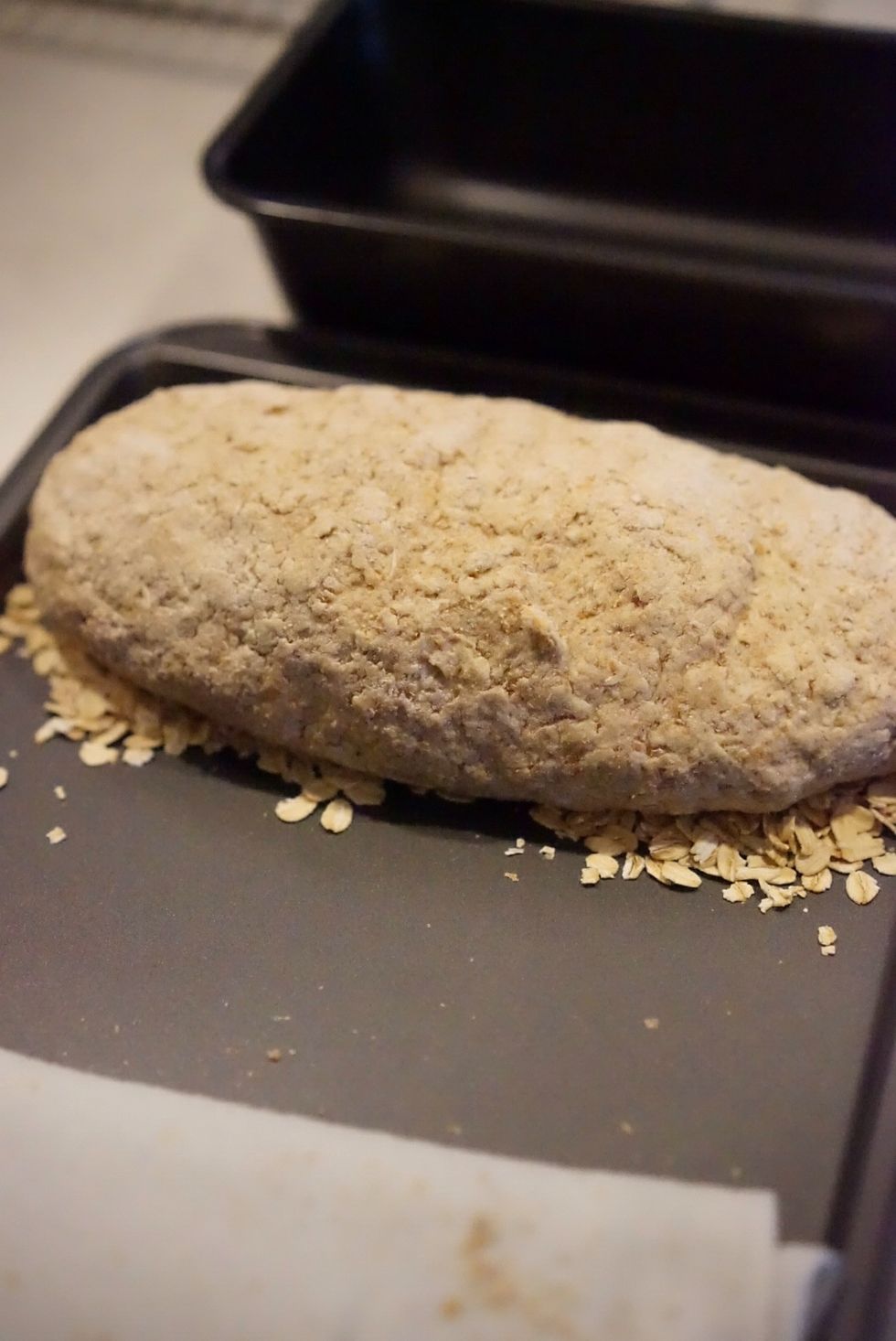 Place the moistened side onto the rolled oats.