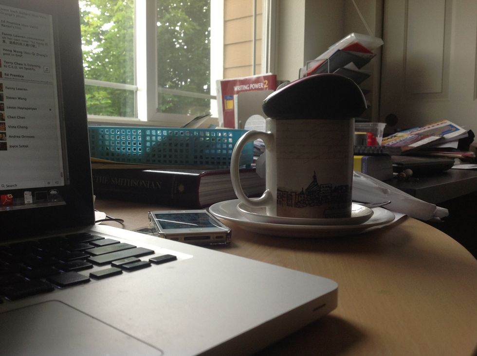 Place the mouse on the cup, so it's lifted above the desk with the support of the cup.