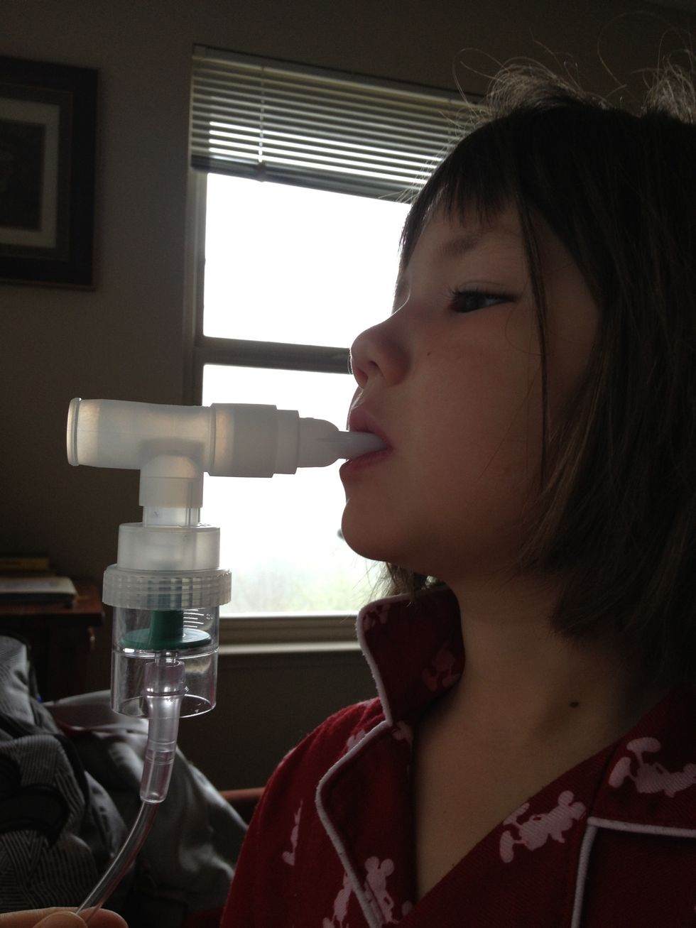 Place the mouthpiece in the persons mouth keeping it as level as possible taking slow deep breaths. After several minutes of breathing tap the side of the mouthpiece to get the medicine to the bottom.