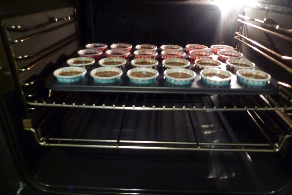 Place the muffin tray in the centre of the preheated oven.