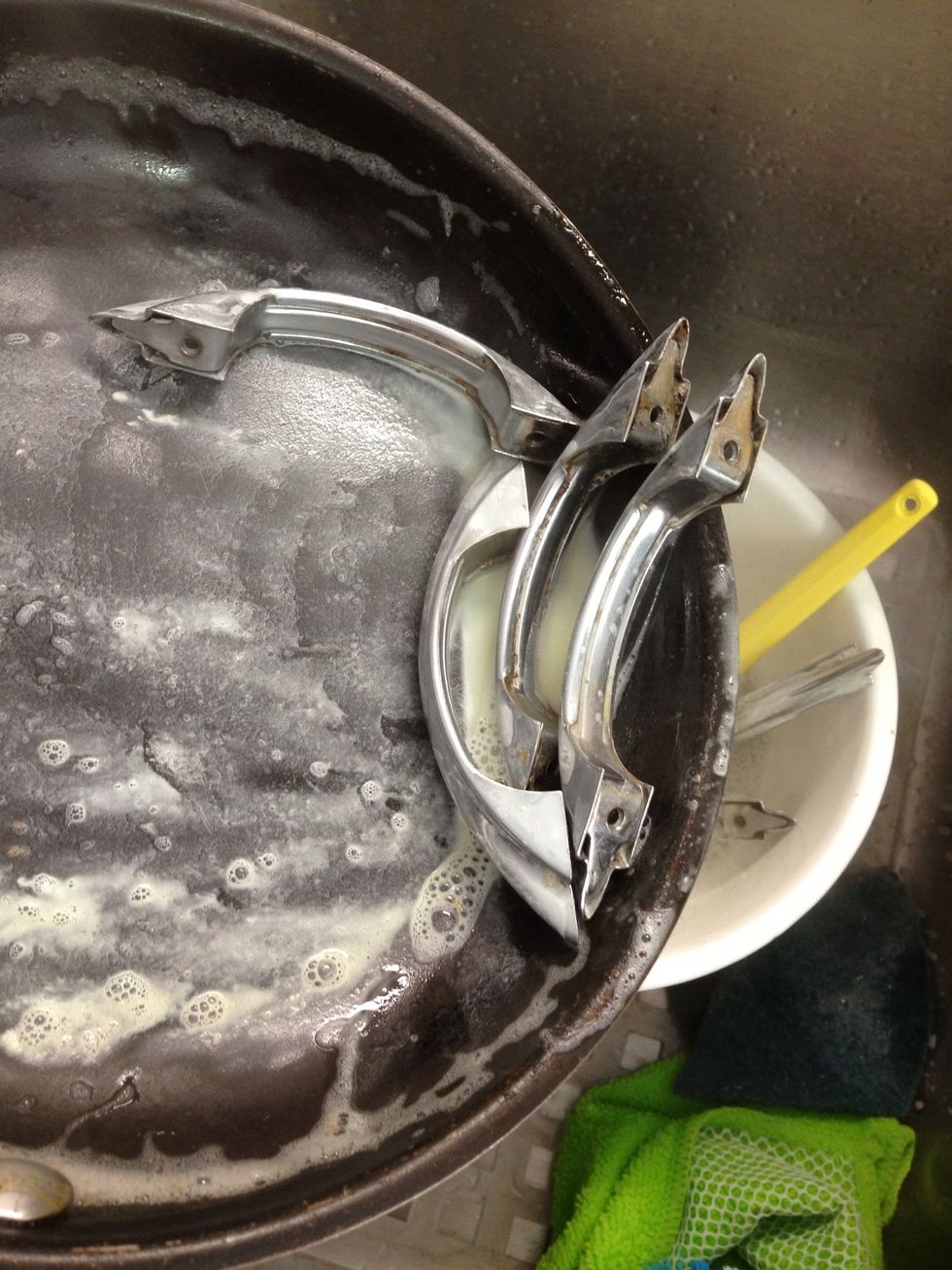 Place the old hardware and enough water to completely cover them and a generous squirt of dish soap in a pan. Bring to a boil. Don't use your favorite pan, it's going to get disgusting ;(