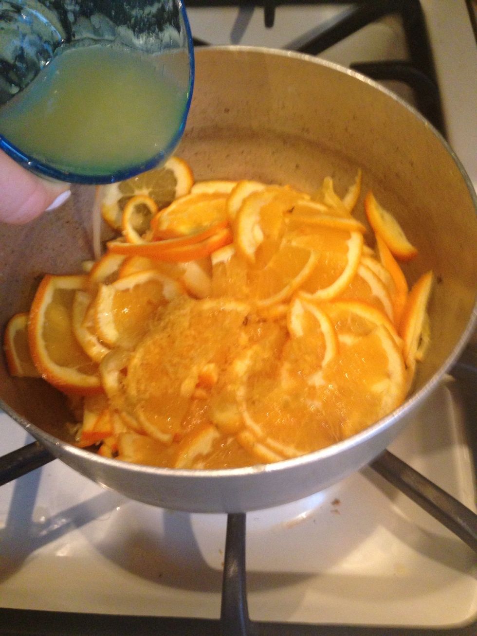 Place the oranges, lemon juice and zest in a medium sized pot.