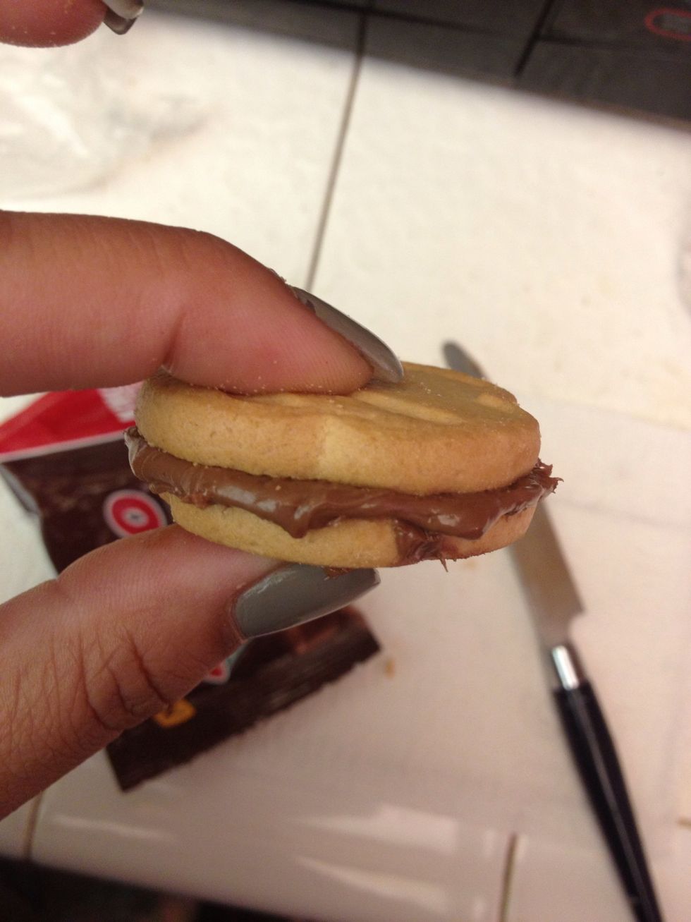 Place the other cookie on-top once Rolos have been spread evenly