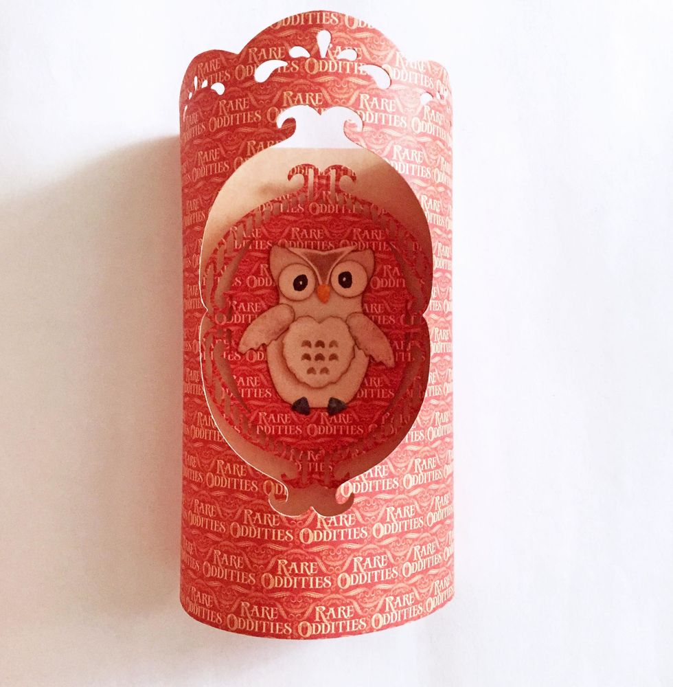 Place the Owl centerpiece inside the candle cover. And you are done!