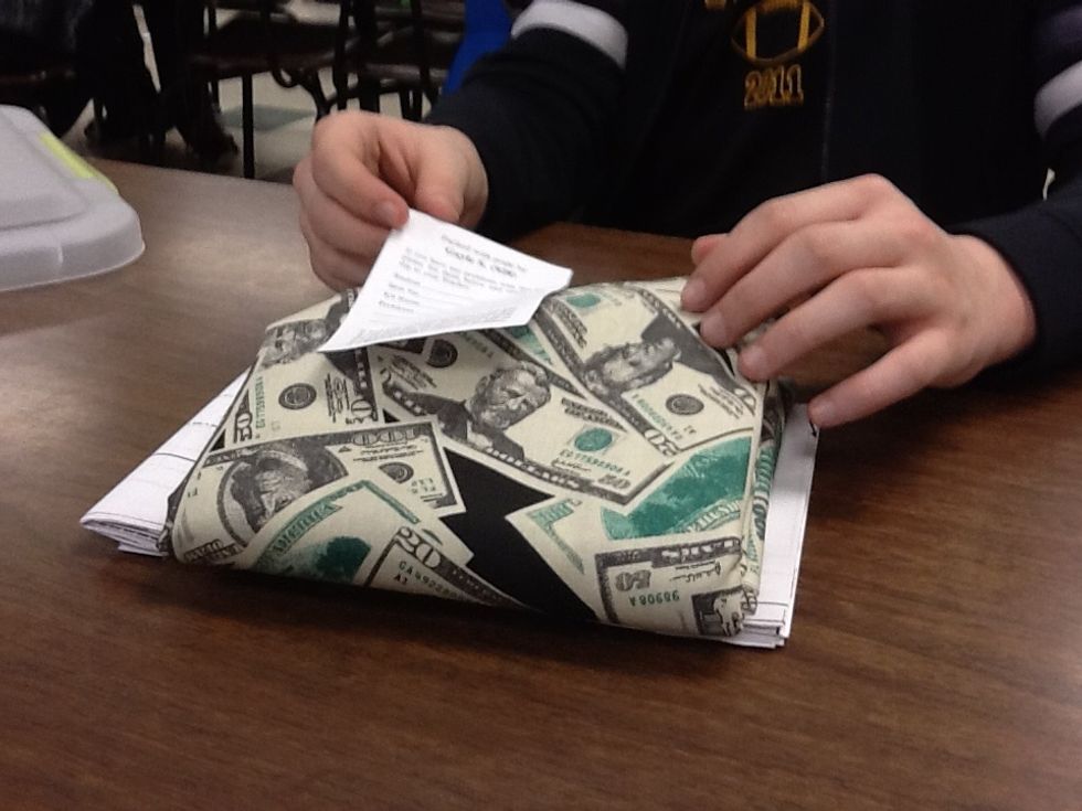 Place the "packed by" slip of paper in the "throw away" pile. DO NOT UNFOLD YOUR FABRIC.