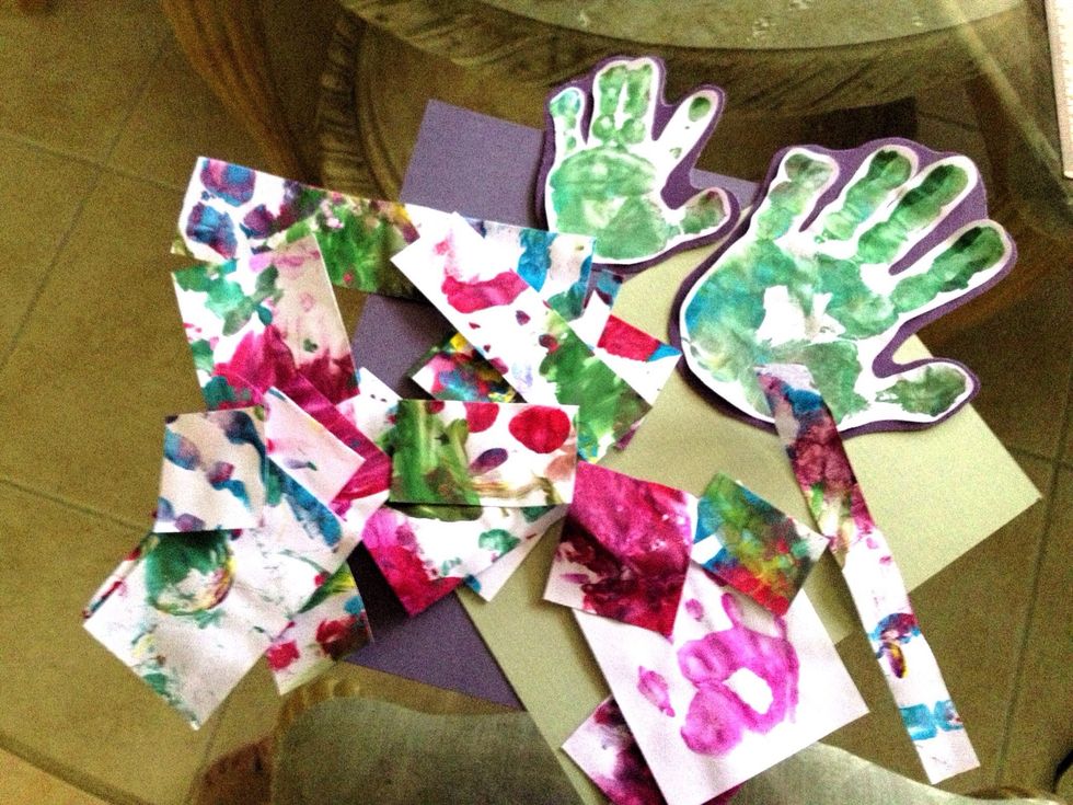 Place the painted hand on a clean part of the paper to make the print. Let dry. Cut out the hands. Trace the hands onto card stock and cut 1/4" larger than the print. Glue print to card stock.