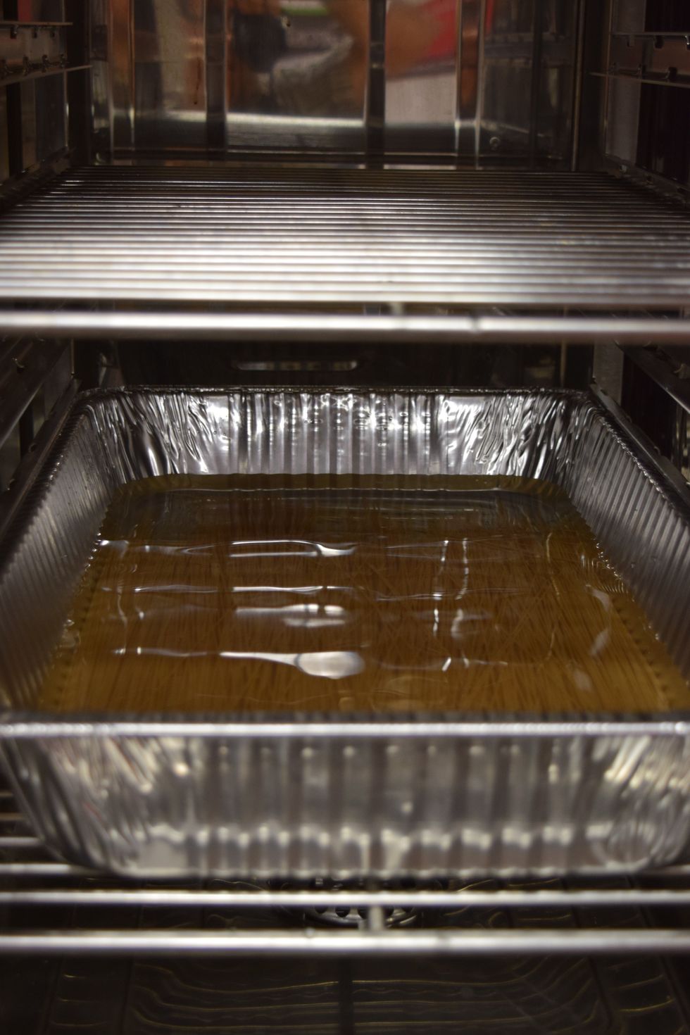 Place the pan into the Alto Shaam Combi oven.