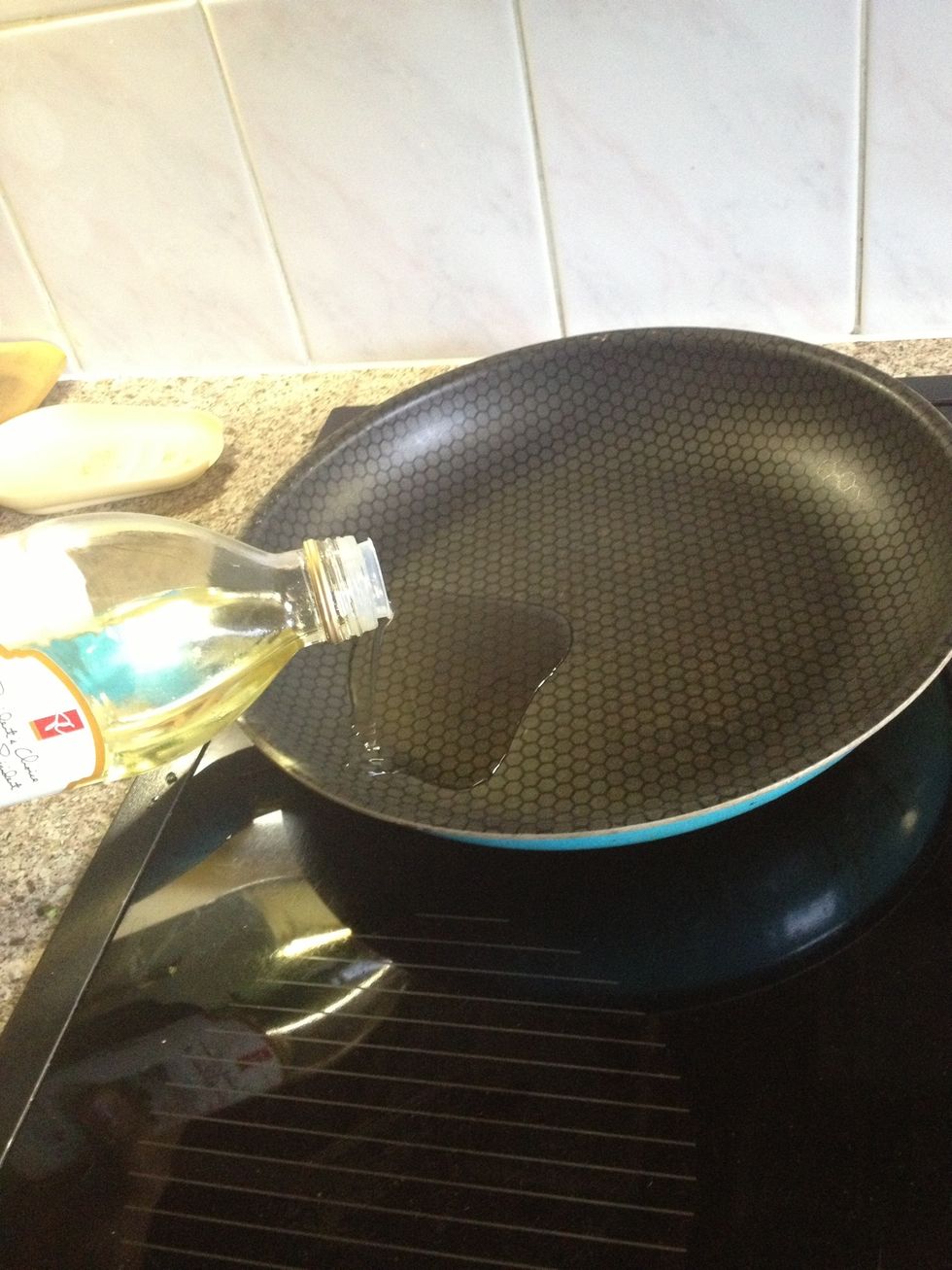 Place the pan on the stove and add the oil. Or butter. Then spread it around