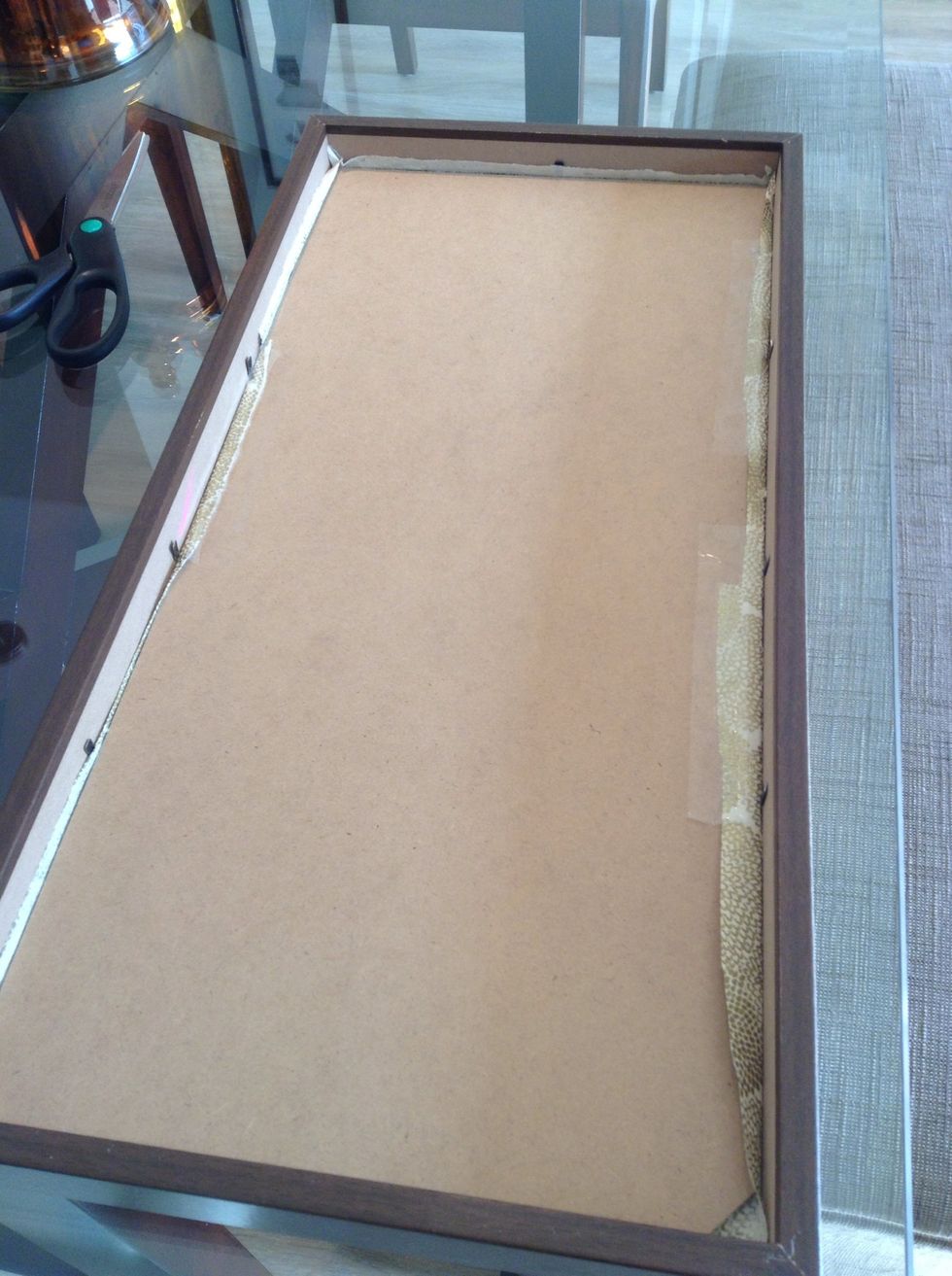 Place the panel back into the frame and secure.