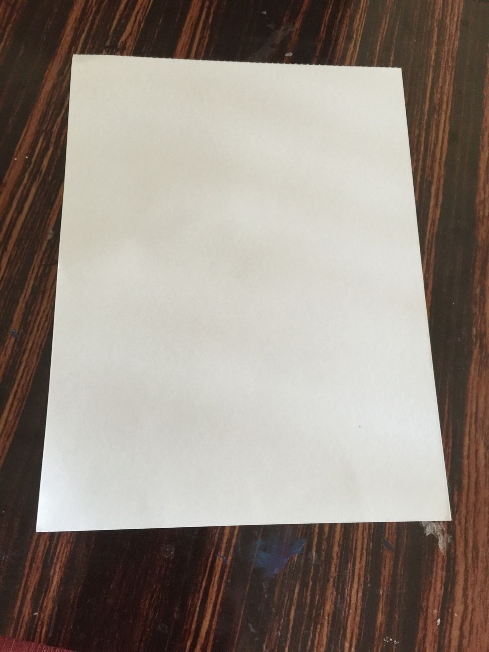 Place the paper on a flat surface.